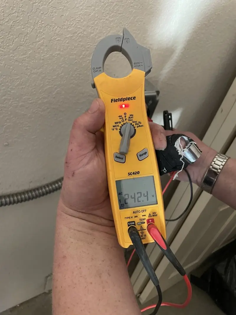 Voltage testing with clamp meter during Electrical Installation Services in Chippewa Falls